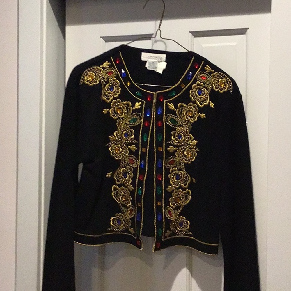 Topper with beautiful embroidery and different colored beads lining the opening.